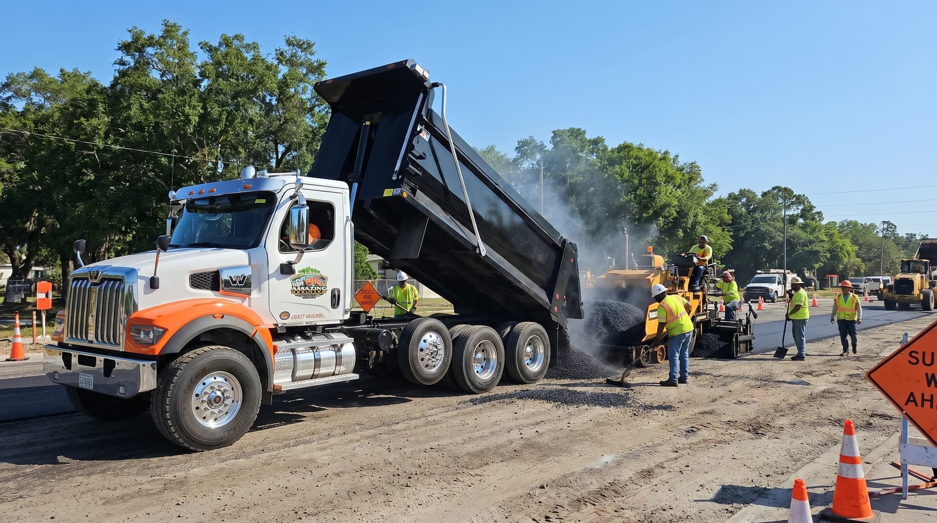 Dump truck hauling asphalt for paving operations